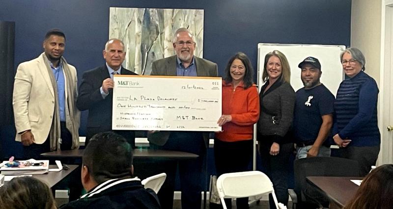 La Plaza Delaware check presentation attendees shown are (l-r) Clay Snead, M&T Bank business banking relationship manager; Nick Lambrow, M&T Bank regional president for Delaware; Randy Kunkle, M&T Bank community reinvestment officer for Delaware and La Plaza board member; Mary Dupont, La Plaza executive director; Mary Ann Smarte, M&T Bank commercial branch manager, Georgetown; Sergio Morales, La Plaza graduate and president of Delaware Alliance of Latino Entrepreneurs; and Cristina Contera, La Plaza instructor. SUBMITTED PHOTO